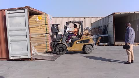 Forklift battling with wood