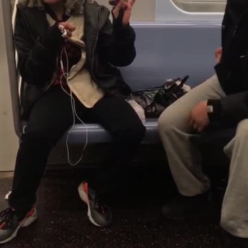 Two sisters argue with each other on the subway