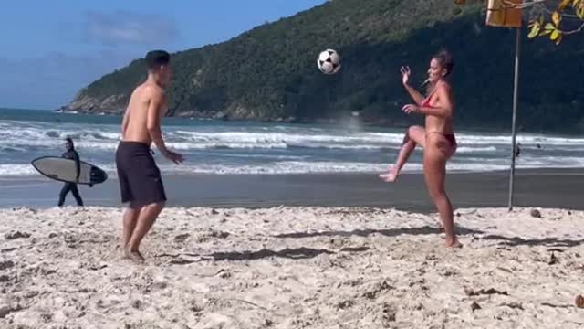 Brazilians playing with the ball on the beach