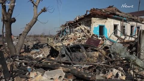 Ukrainians pick through rubble after Russian bombing