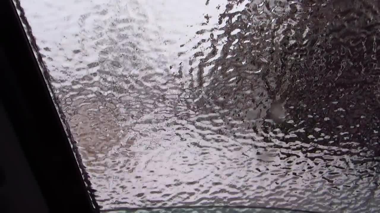 Ice storm. Smashing the car window.