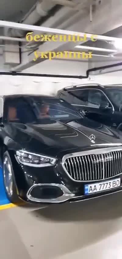 Pole admires luxury cars of Ukrainian refugees
