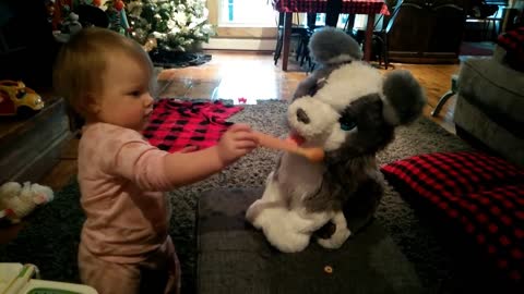 BABY GRANDAUGHTER VIOLET FEEDING HER PUPPY