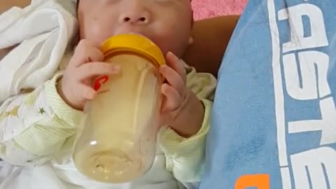 This is a video of a baby eating formula hard.