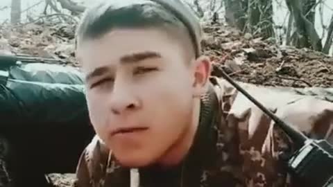 Ukrainian soldier eating snack as Russian artillery is shelling