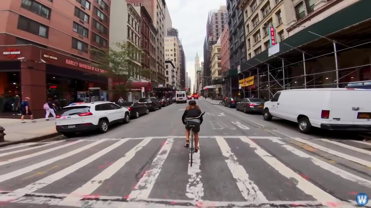 Bike Messenger Riding Fast and Fluid Through NYC Traffic