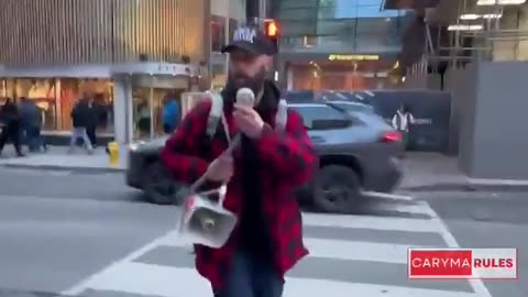 Canada First protesters march down Yonge Street chanting, “We love Canada!”