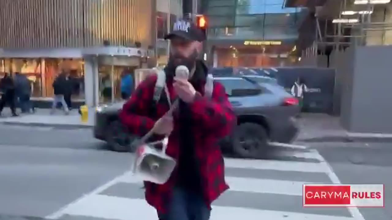 Canada First protesters march down Yonge Street chanting, “We love Canada!”