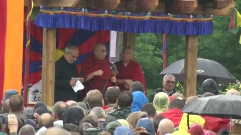 Dalai Lama takes stage at Glastonbury