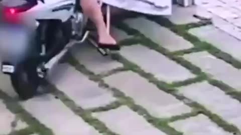 chick gets stuck on her scooter then takes off with the washing.