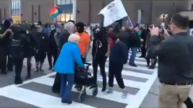 Wayback- ANtifa blocks elderly with a walker from crossing the street.