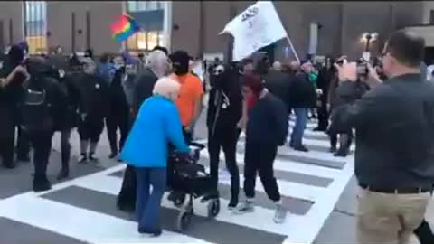 Wayback- ANtifa blocks elderly with a walker from crossing the street.