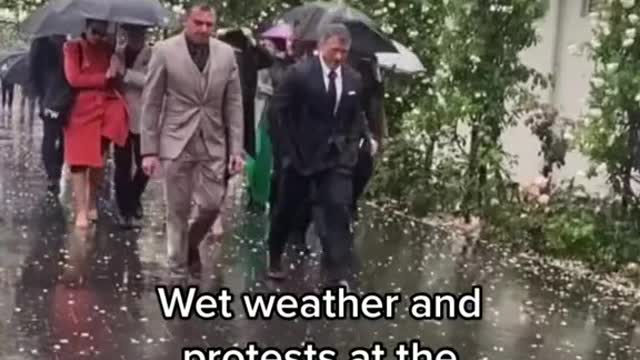 A wet Melbourne Cup has not kept protesters or revellers away from