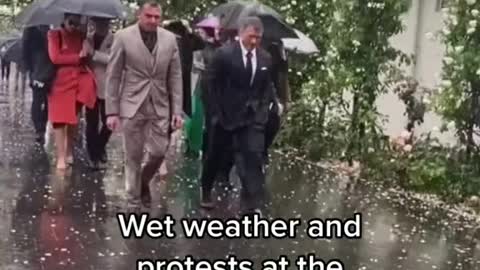 A wet Melbourne Cup has not kept protesters or revellers away from