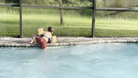 Little Boy Leaps Into Pool to Save Anna Doll