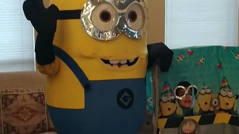 Houston mascot party character minion poses in Gru's lab with new friends in Pearland at a birthday