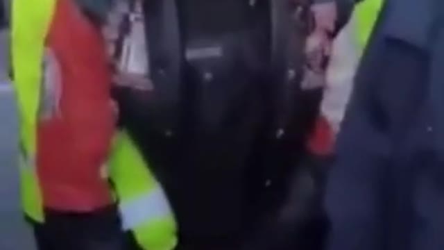 Police in Ottawa detain a man with a gas can