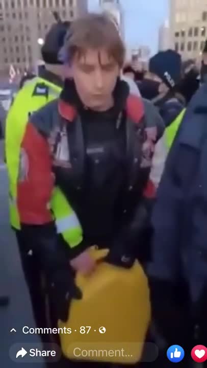 Police in Ottawa detain a man with a gas can