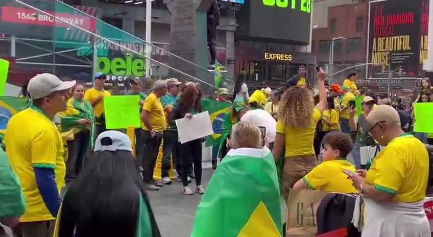 Protesters gather in Times Square chant BRAZIL WAS STOLEN