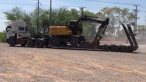 Incredible Skill Trailer Operator Bring Wheeled Excavator Clump To Mountain