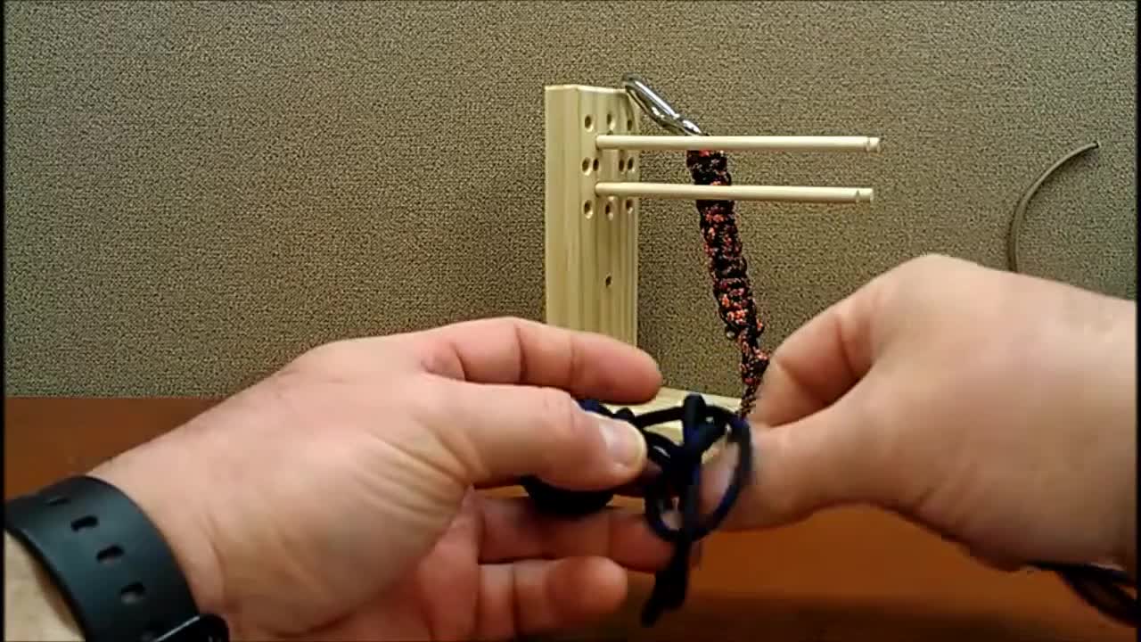 Using a monkey fist jig to tie a Monkey fist. Part 3
