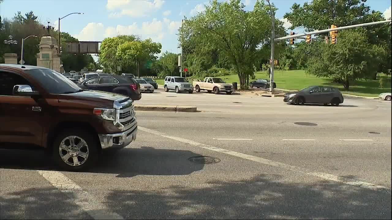 Woman desperately trying to escape squeegee altercation