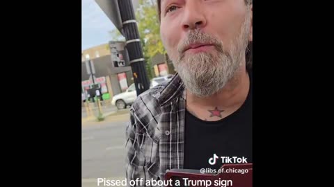 Crazy Guy goes mental on Trump supporter for holding a Trump sign