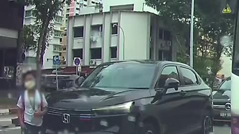 Lucky boy narrowly misses motorcyclist while jaywalking