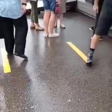 Vax site. People wait in line to get a shot