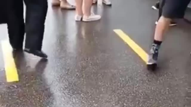 Vax site. People wait in line to get a shot