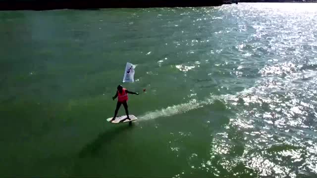 Surfing UK striker takes picket line to the sea