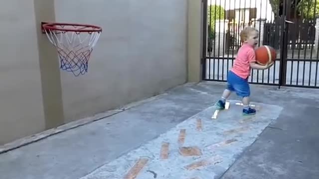 baby playing basketball, amazing