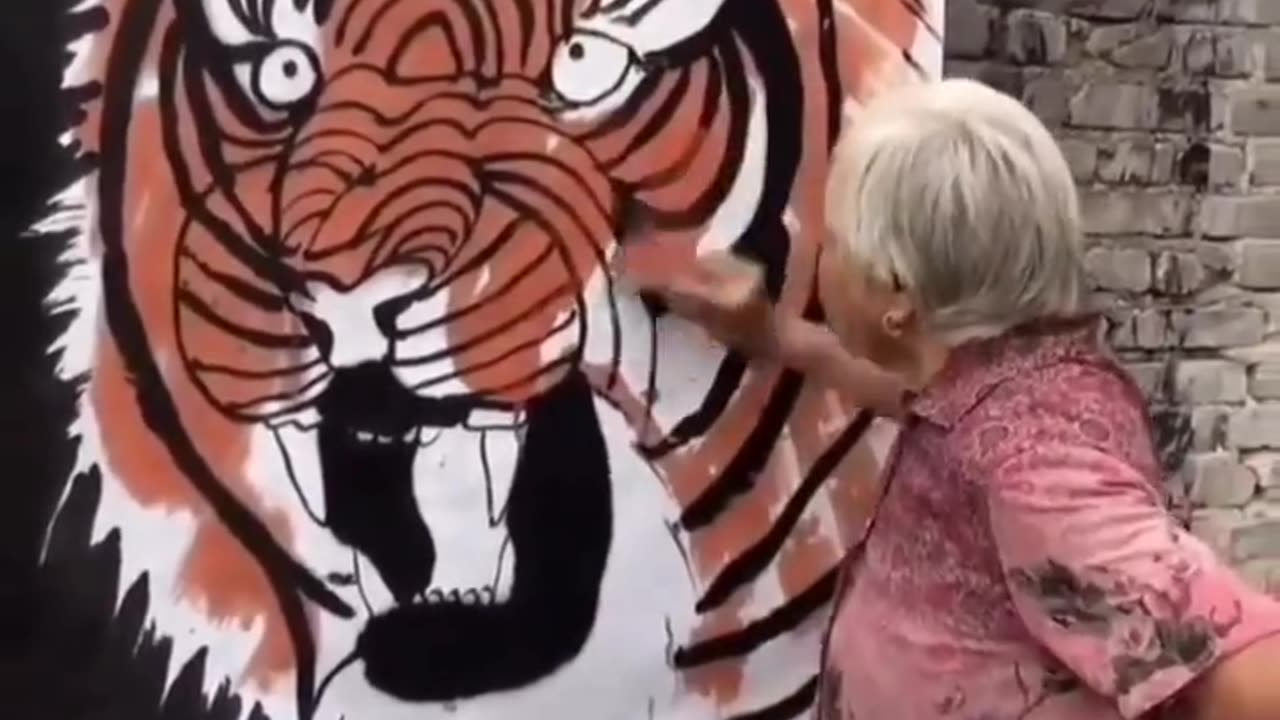 Old Lady Making a amazing art of tiger