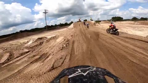 Motorcyclist Lands on Top of Another Rider During First Lap of Race