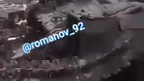 Russian Soldier Films a Destroyed Tank