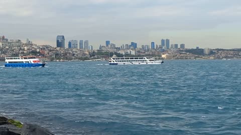 A beautiful natural view of the sea with calm waves and the passage of two ships