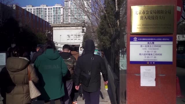 Chinese rush to renew passports as curbs lifted
