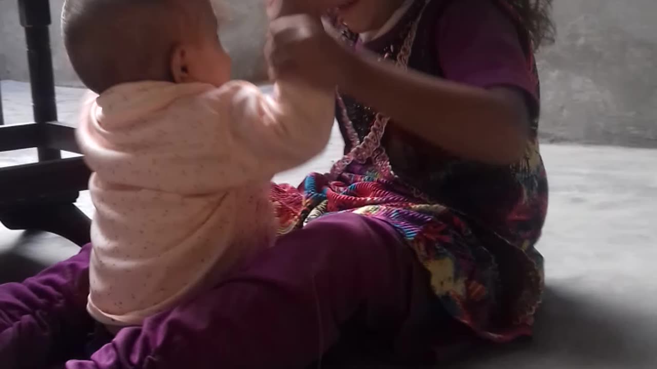 Charming Toddler Duo: Heartwarming Moments of Baby Girls' Playtime and Bonding