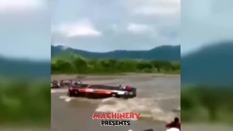 DANGEROUS FLOODED RIVER AND TRUCKS