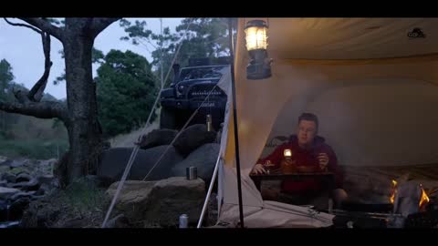 Self driving outdoor camping, enjoying the beauty of the summer forest. Loneliness is the norm of li