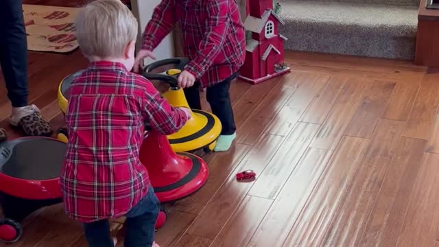 Twin Boys Toss Their Toys in Excitement