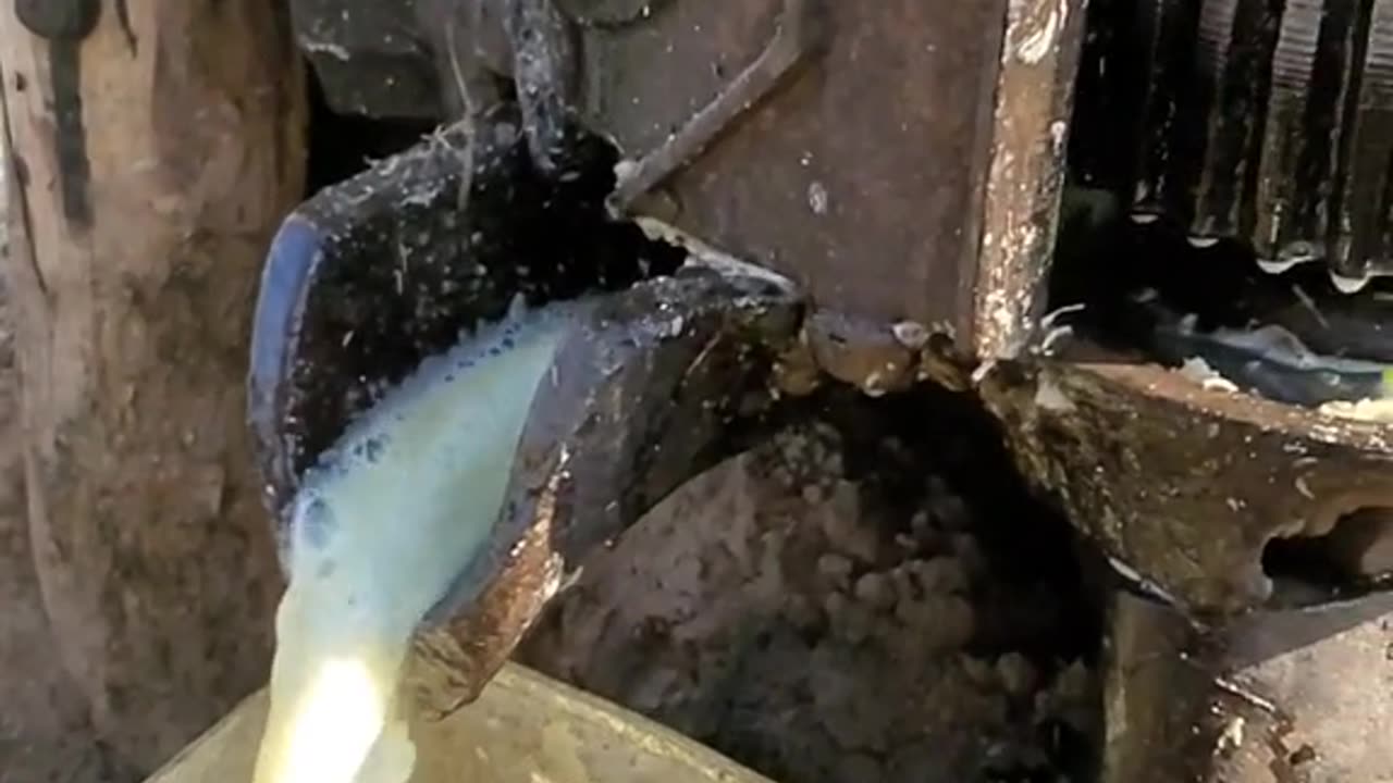 Extracting sugarcane juice from a sugarcane machine in the fields