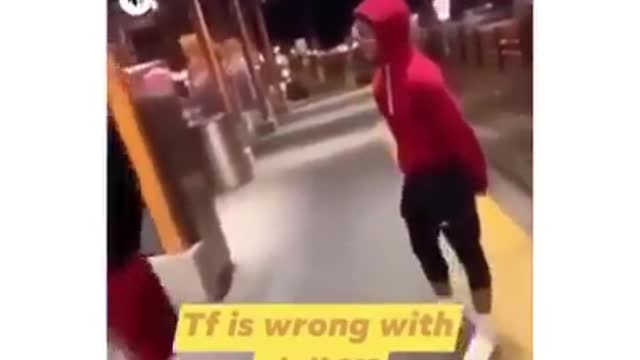 Racist black Thugs circle round an Asian grandmother and then kicks her in the face for clout