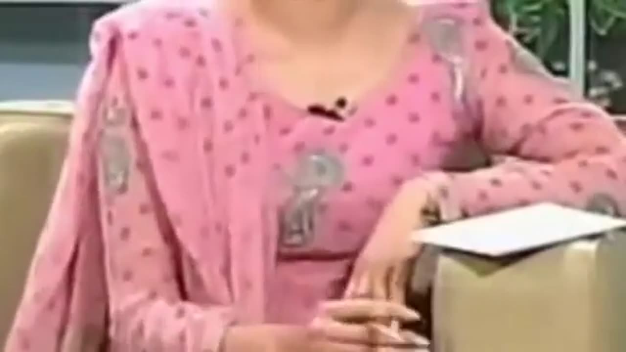 Cameramen zoom to news presenter bXXbs while live presentation
