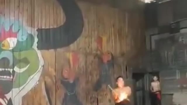 A man playing with fire