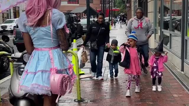A dressed girl walking in the street