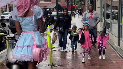 A dressed girl walking in the street