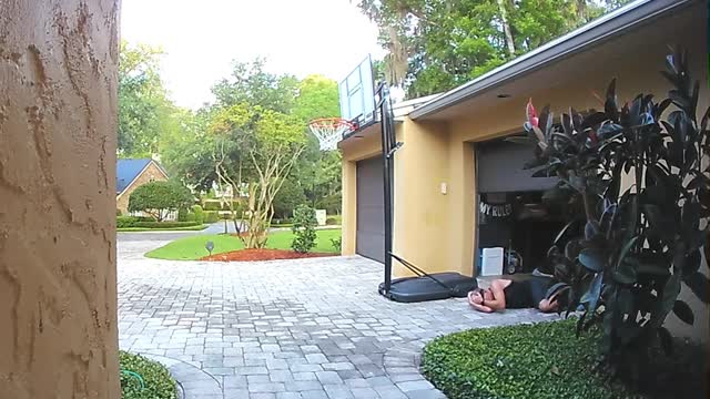 Guy Fell After Hitting Head Against Garage Door Not Paying Attention