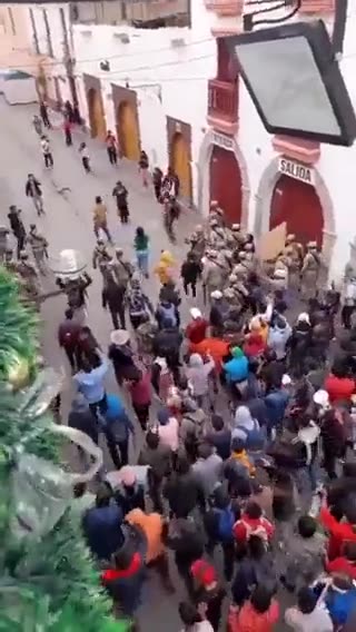 JUST IN: Protesters from Peru drive Peruvian police