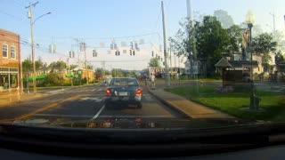 Driver stops, waits for people to cross before running red